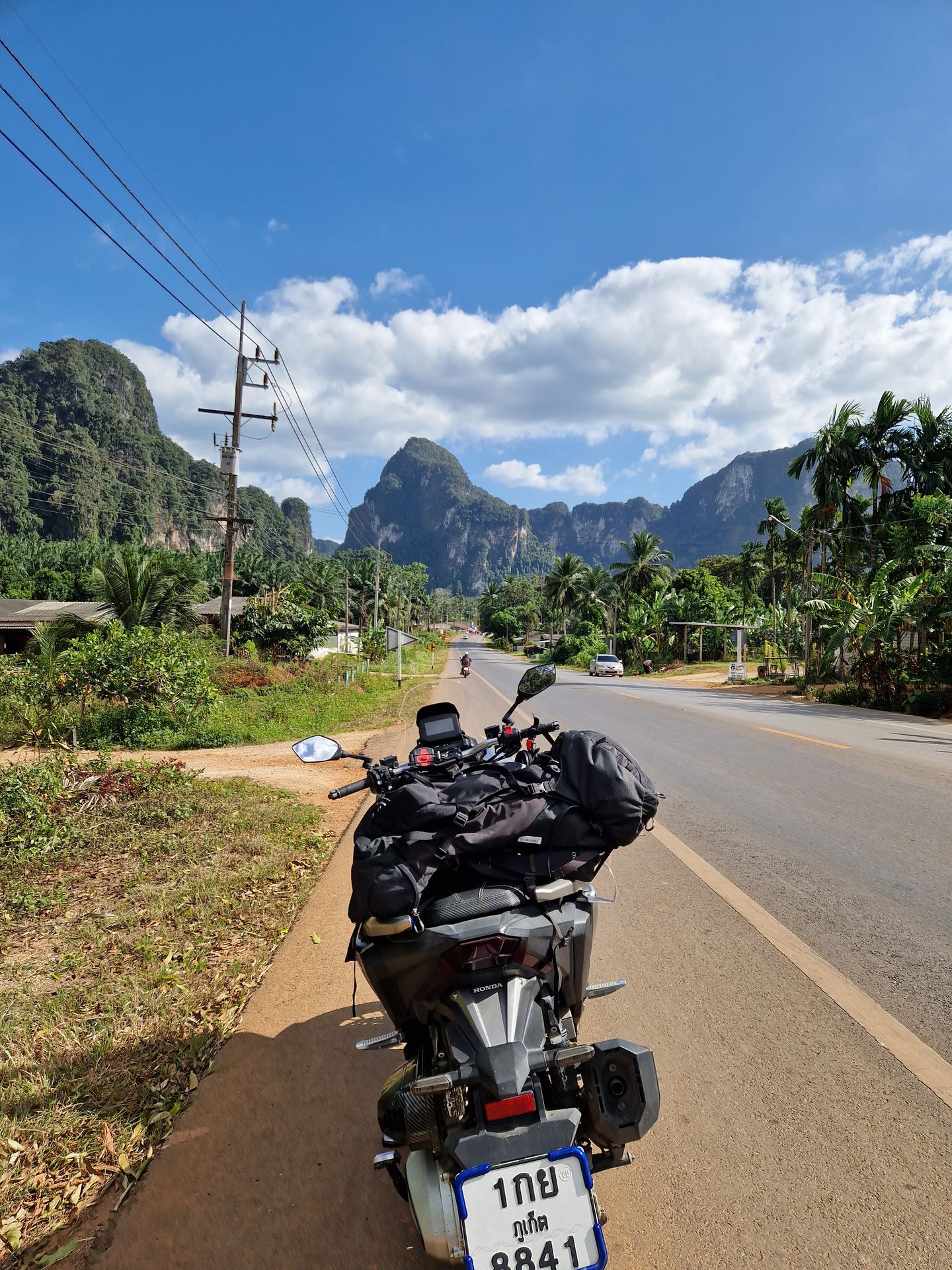 Motorcycle on a road through the mountains of South Thailand
